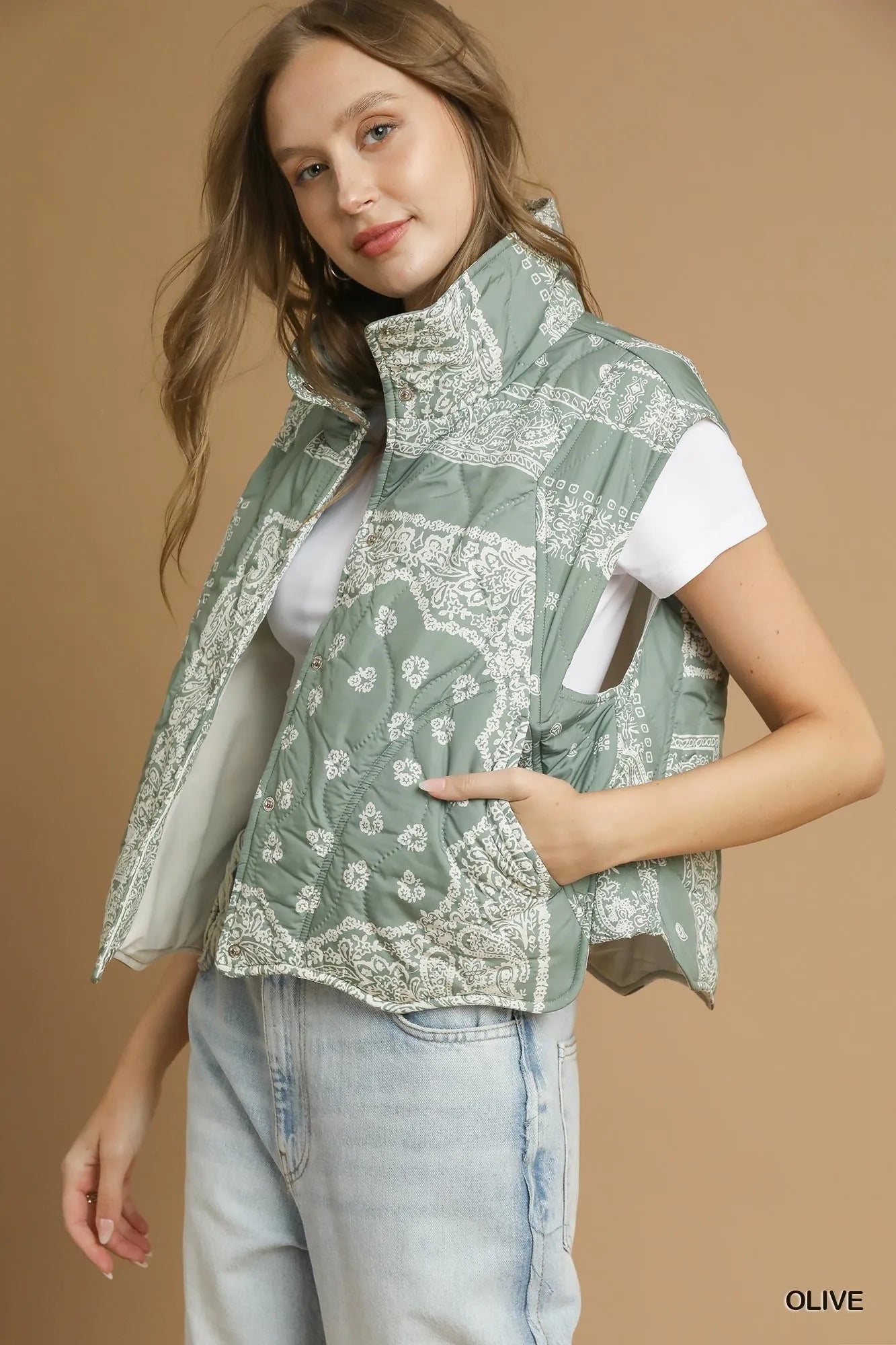 Olive green Umgee bandana print quilted puffer vest with a relaxed fit and front zipper, perfect for layering and casual wear.