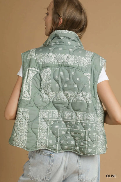 Olive green Umgee quilted puffer vest with bandana print and collar, featuring a front zipper and quilted pattern.