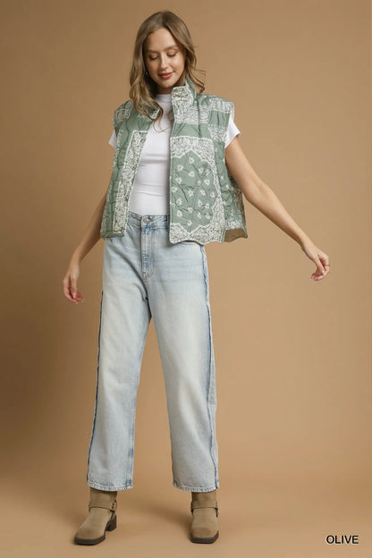Olive green Umgee bandana print quilted puffer vest with a stand collar and front zipper, styled for casual wear.