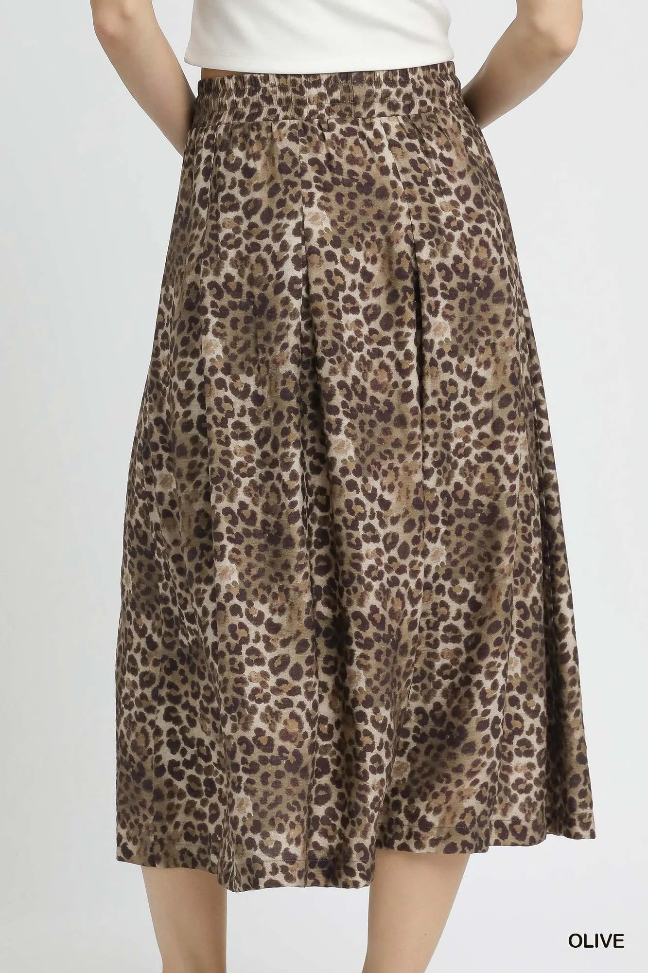 Olive green Umgee drawstring leopard midi skirt from Trendsi, featuring a stylish leopard print and comfortable waist tie.