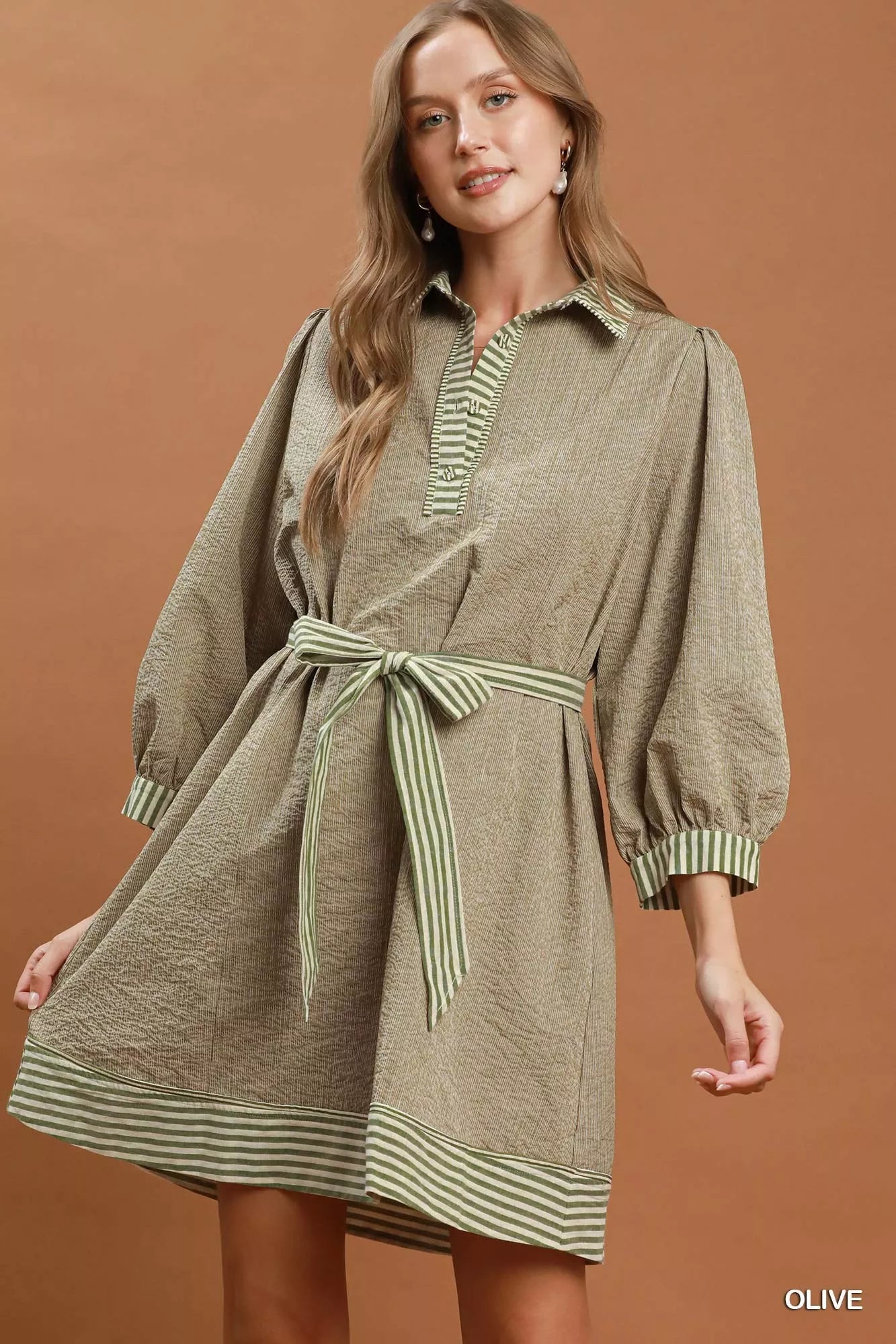 Olive green Umgee striped contrast belted puff sleeve mini dress with a relaxed fit and stylish design.