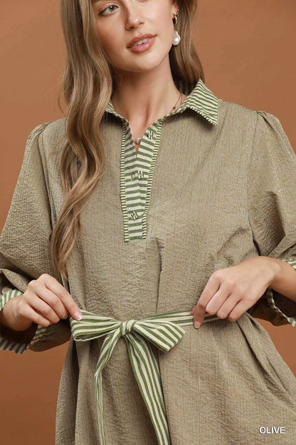 Olive green Umgee striped contrast belted puff sleeve mini dress with a cinched waist and stylish design, perfect for casual wear.
