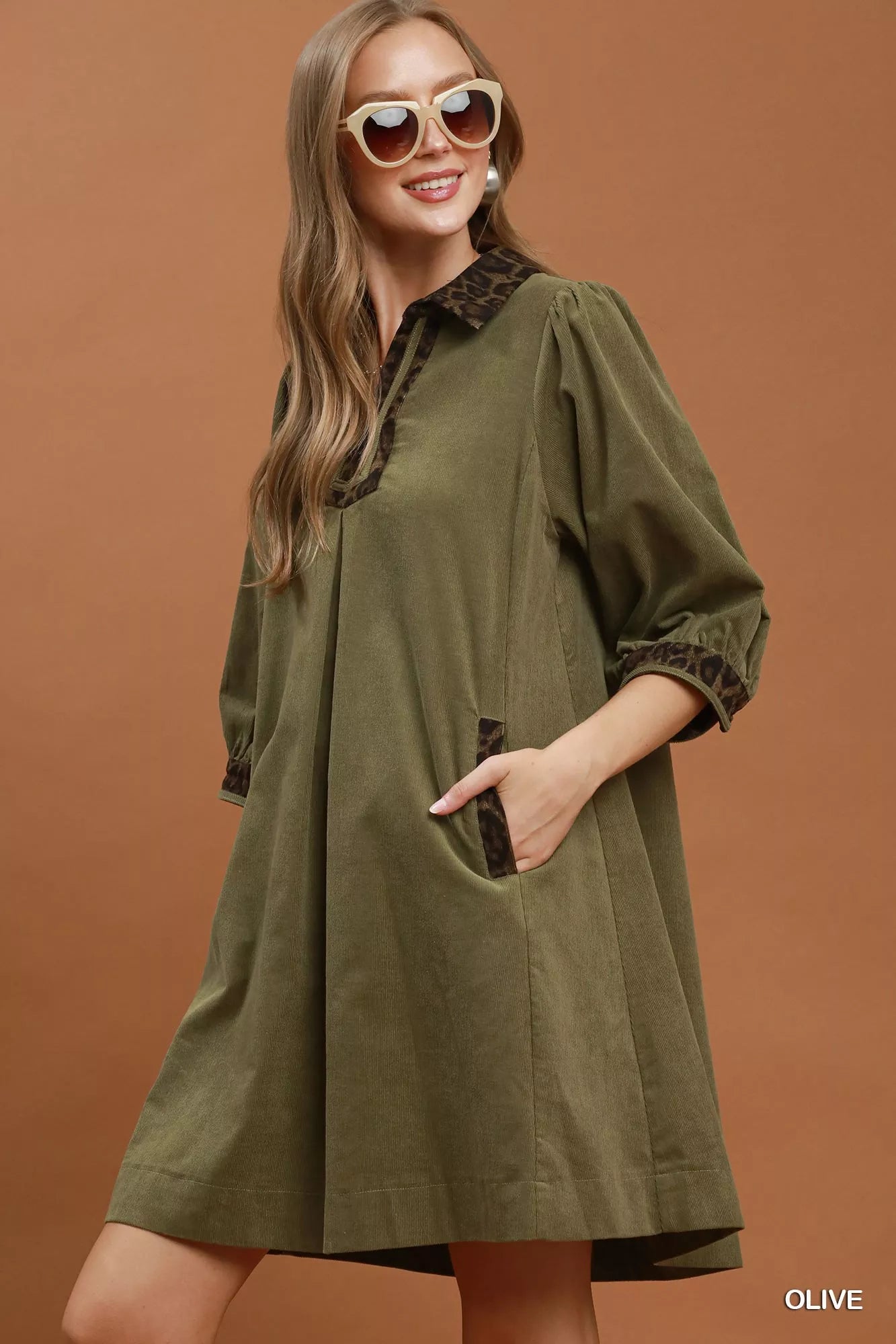 Olive green Umgee V-Neck Shift Dress with contrast trim, short sleeves, and relaxed fit, styled for casual wear.