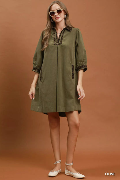 Olive green Umgee V-neck shift dress with contrast trim, casual style, short sleeves, and relaxed fit.