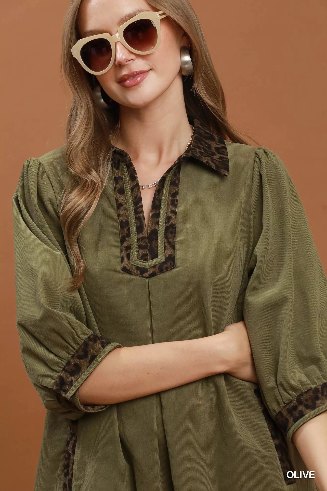 Olive green Umgee V-neck shift dress with contrast trim, casual style, short sleeves, and relaxed fit.