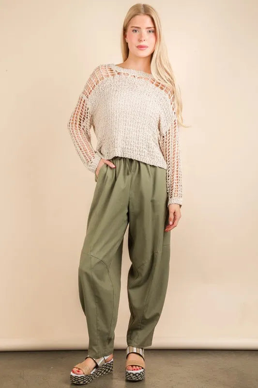 Olive green Very J Solid Barrel Comfy Woven Pants by Trendsi, featuring a relaxed fit and woven fabric, shown on a model.