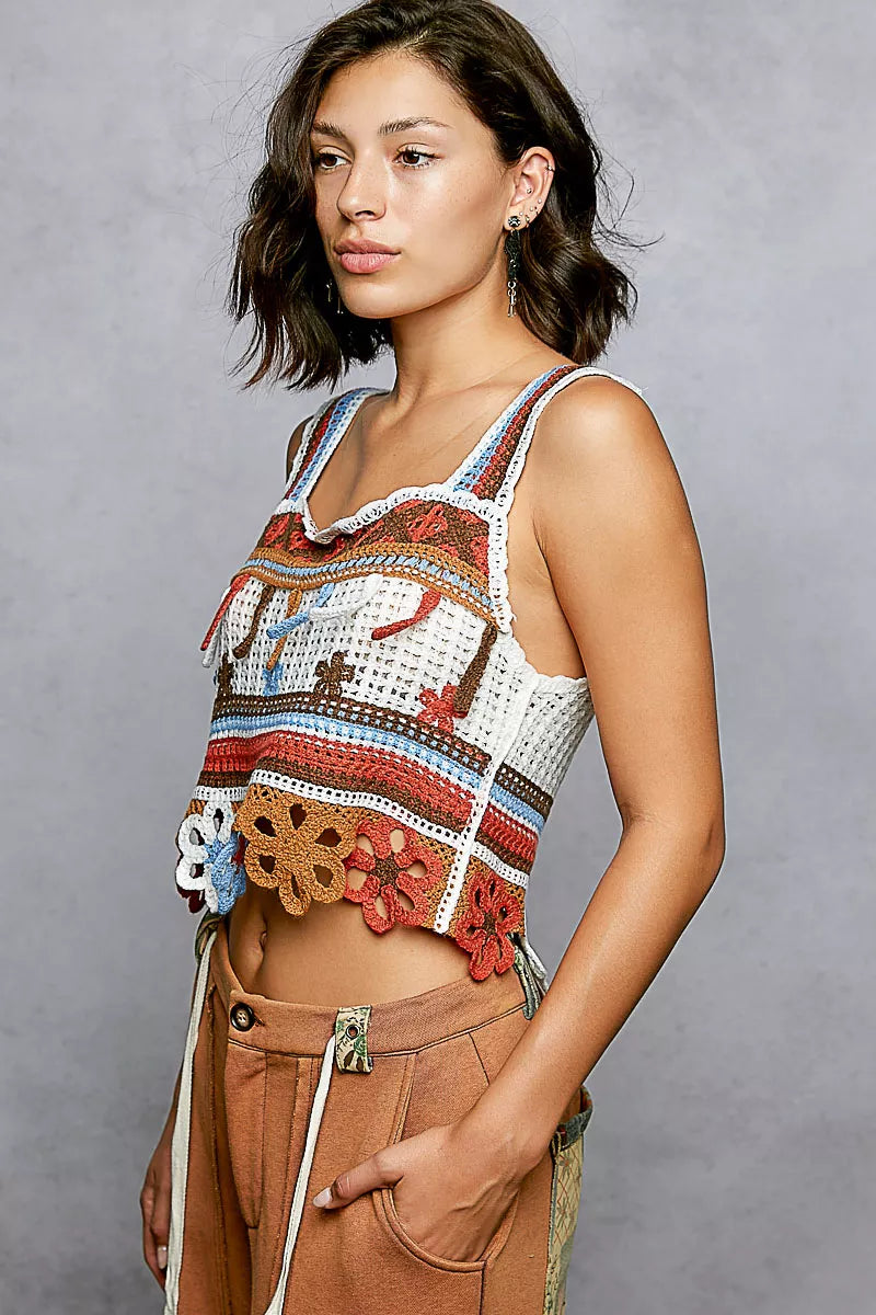 Orange multi POL Cutout Flower Cropped Crochet Cami with Dangle Detail, trendy sleeveless top by Trendsi, featuring floral pattern and unique accents.