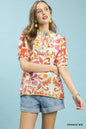 Orange floral split-neck short sleeve top by Umgee, featuring a mix of colorful floral patterns and a relaxed fit.