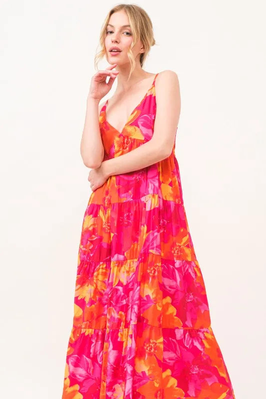 Orange multi floral tiered maxi cami dress with pockets by Trendsi, featuring a flowy silhouette and adjustable straps.