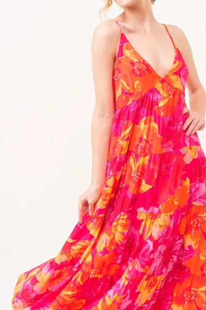Orange multi floral tiered maxi cami dress with pockets from And The Why by Trendsi, featuring a flowy design and sleeveless style.