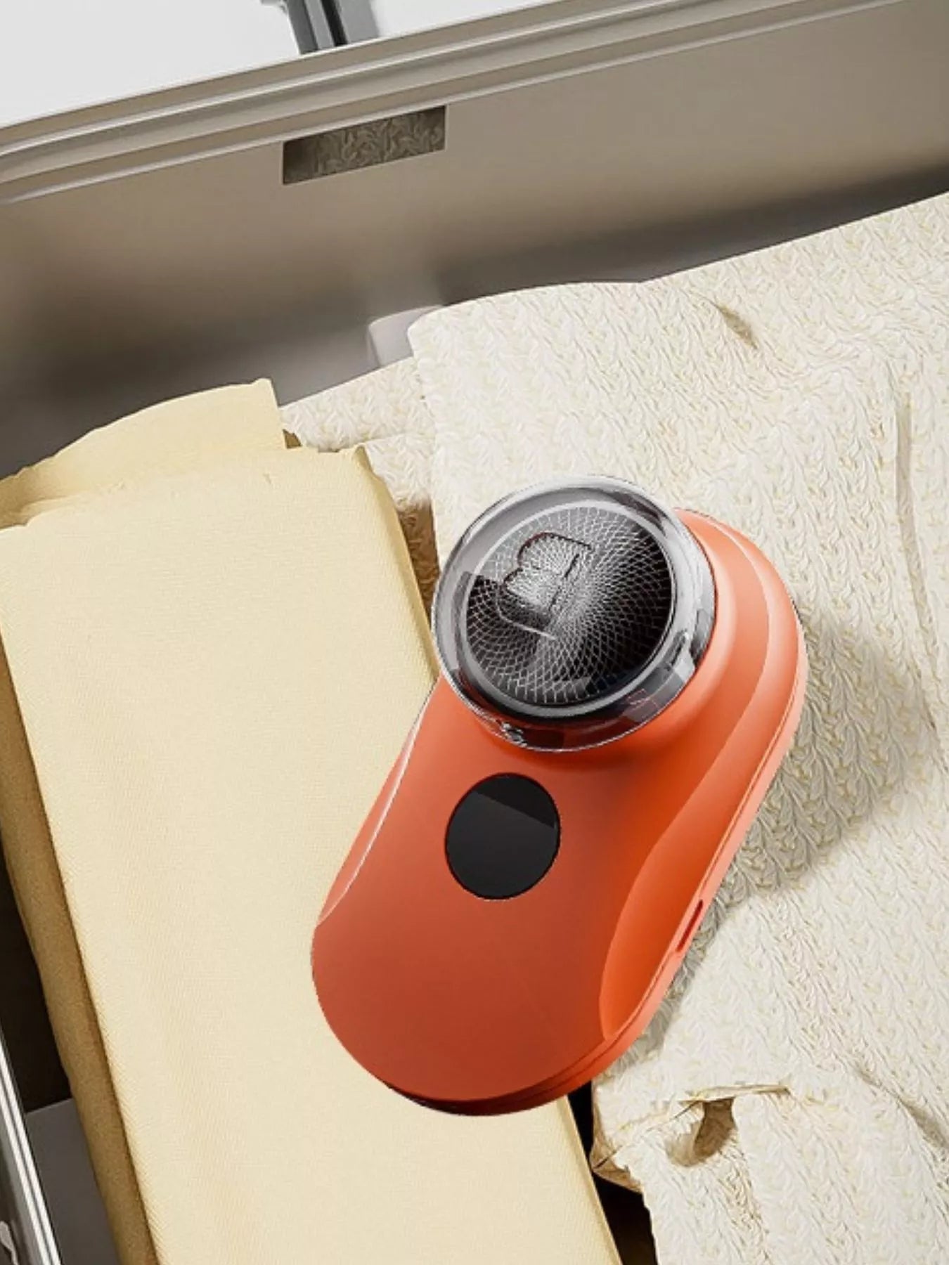 Orange portable mini electric shaver by Trendsi, compact design ideal for travel grooming and quick shave.