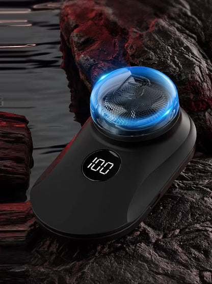 Orange portable mini electric shaver by Trendsi, compact design with a sleek handle for easy grooming on the go.