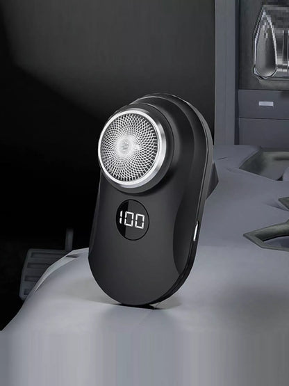 Orange portable mini electric shaver by Trendsi, compact design with a sleek handle for easy grooming on the go.