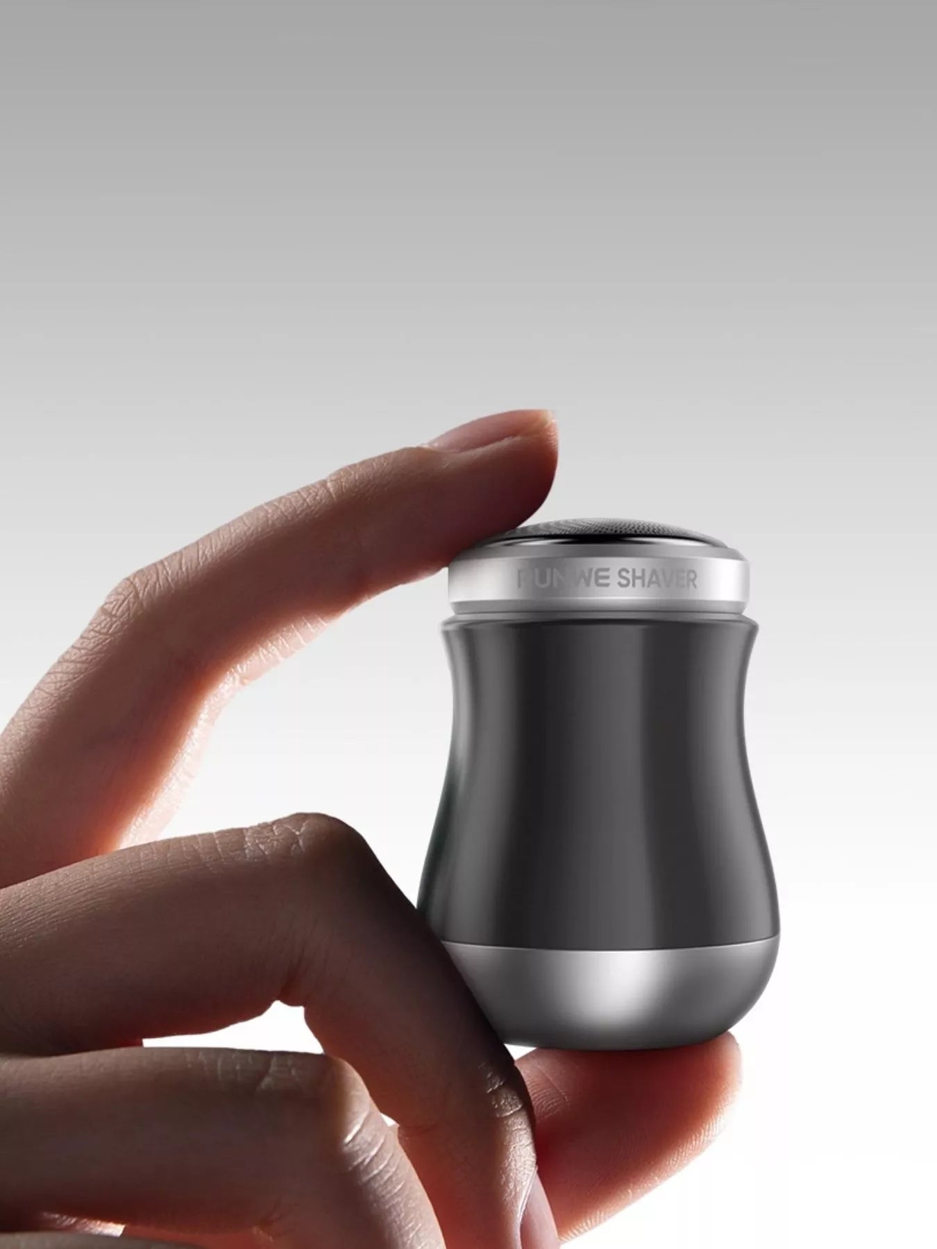 Orange portable mini electric shaver by Trendsi, compact design with a sleek handle and shaving head for easy grooming.