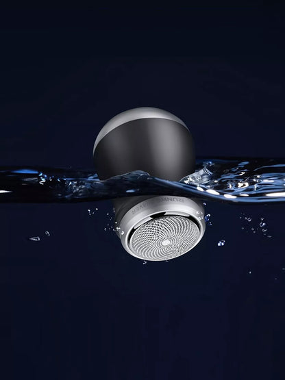 Orange portable mini electric shaver by Trendsi, compact design with a sleek handle for easy grooming on the go.