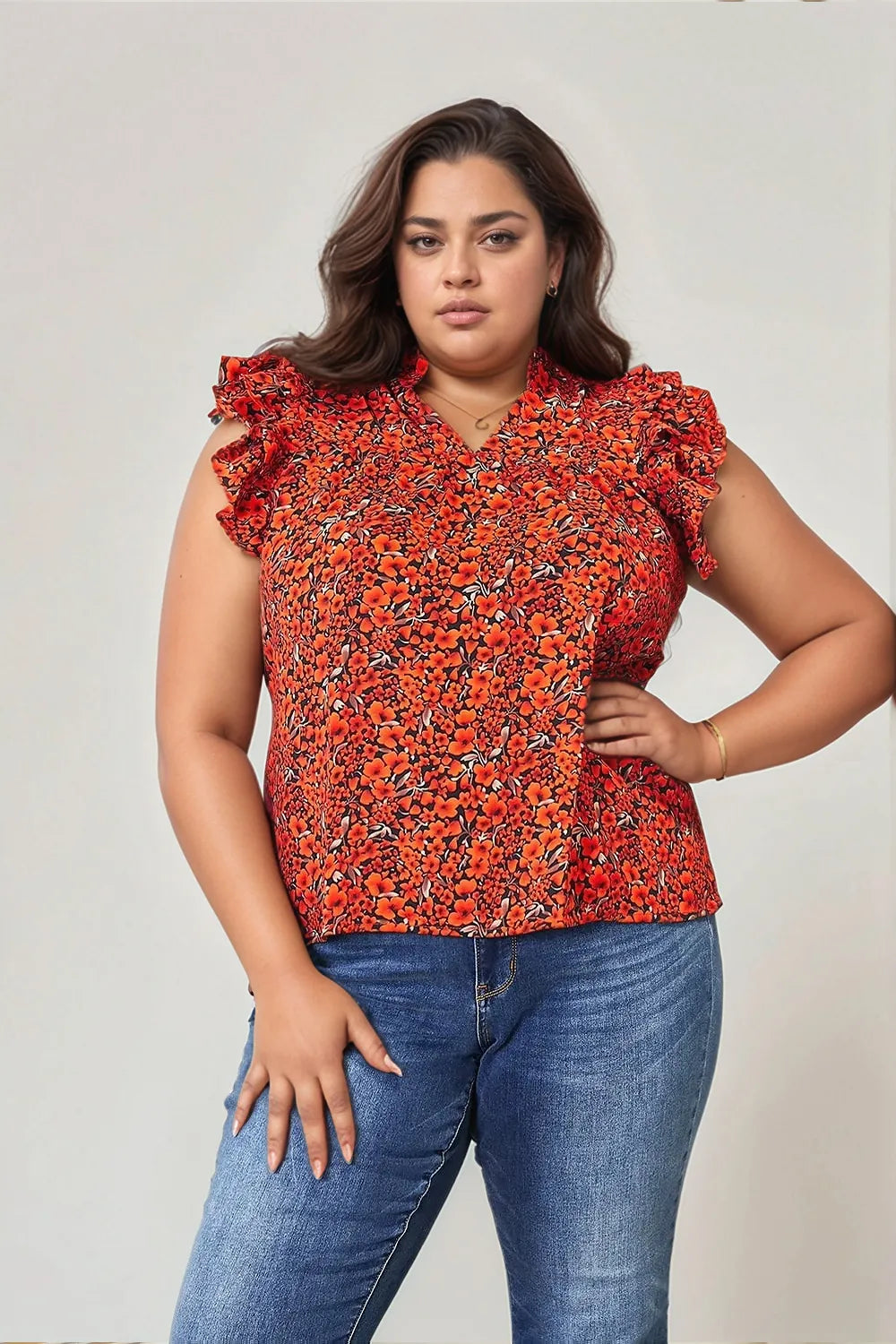 Orange-red floral flutter sleeve blouse with notched neckline from Trendsi, showcasing lightweight fabric and stylish design.