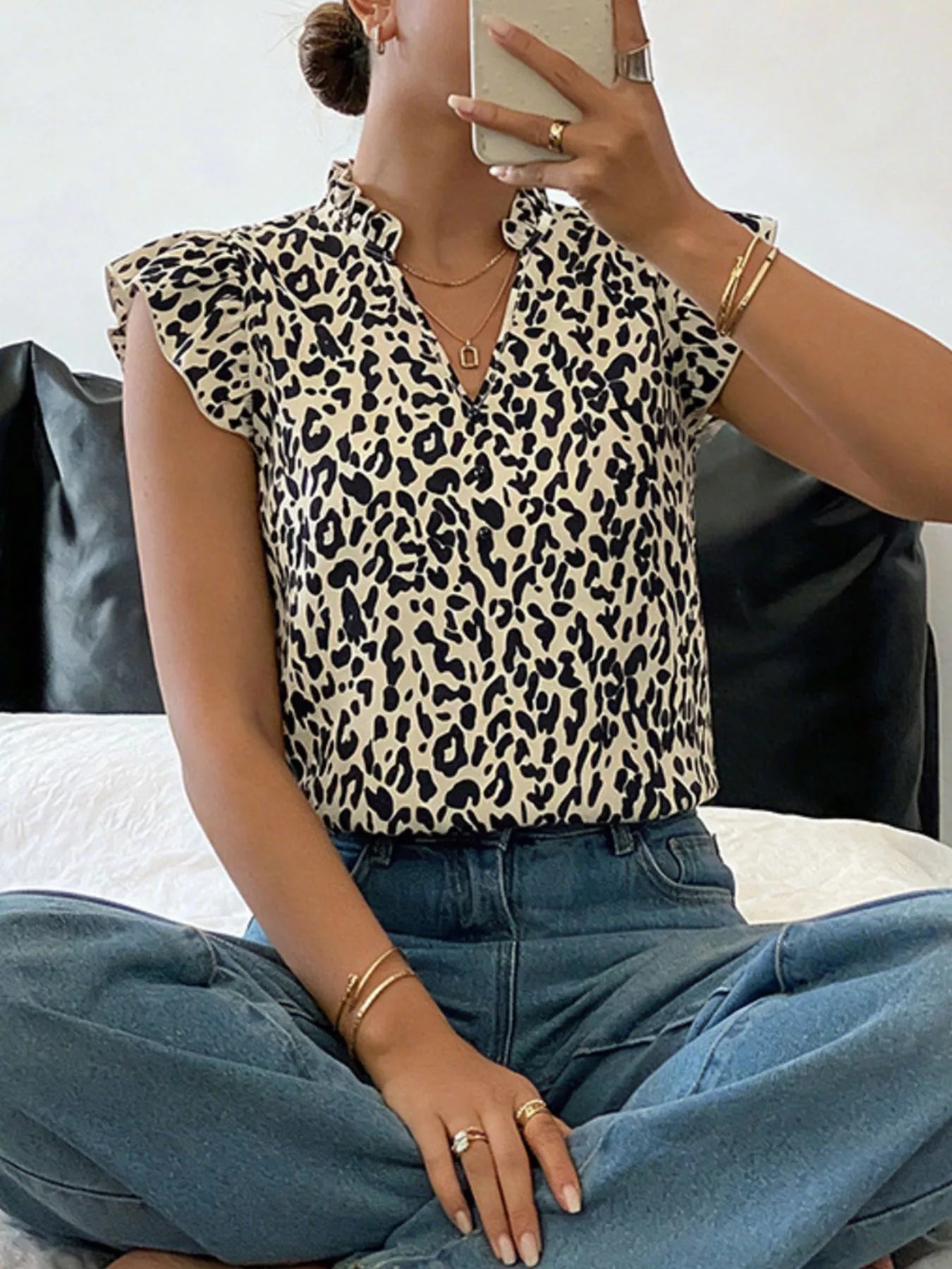Orange-red leopard print ruffle sleeve blouse by Trendsi, featuring a stylish ruffle detail and vibrant animal print fabric.
