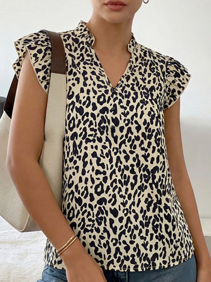 Orange-red leopard print blouse with ruffle sleeves, stylish Trendsi women's top featuring bold animal print and feminine ruffle details.