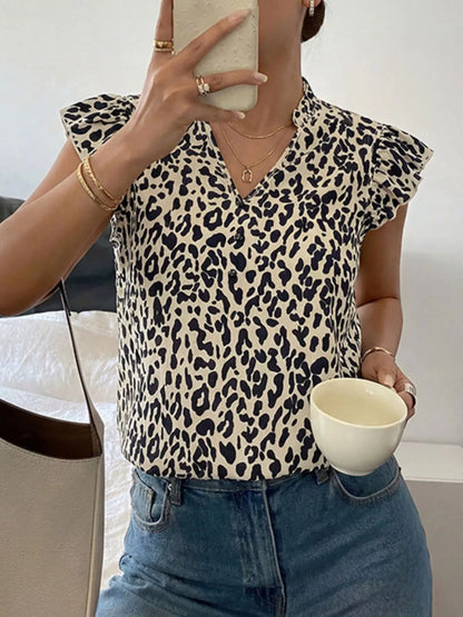 Orange-red leopard print ruffle sleeve blouse by Trendsi, featuring stylish ruffles and bold animal print design.