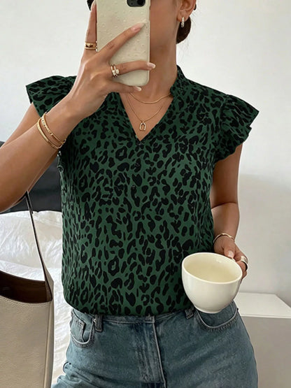 Orange-red leopard print blouse with ruffle sleeves by Trendsi, featuring a stylish, flowy design and bold animal print pattern.