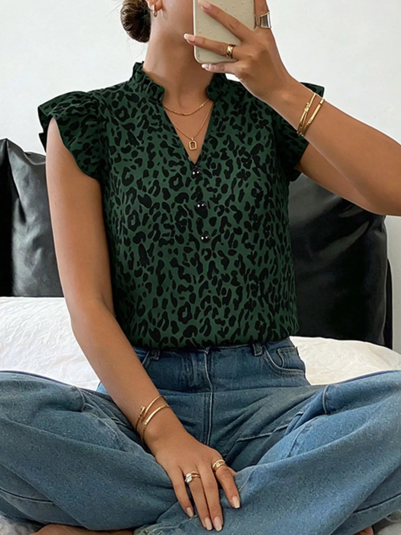 Orange and red leopard print ruffle sleeve blouse by Trendsi, featuring a stylish and bold animal print design.