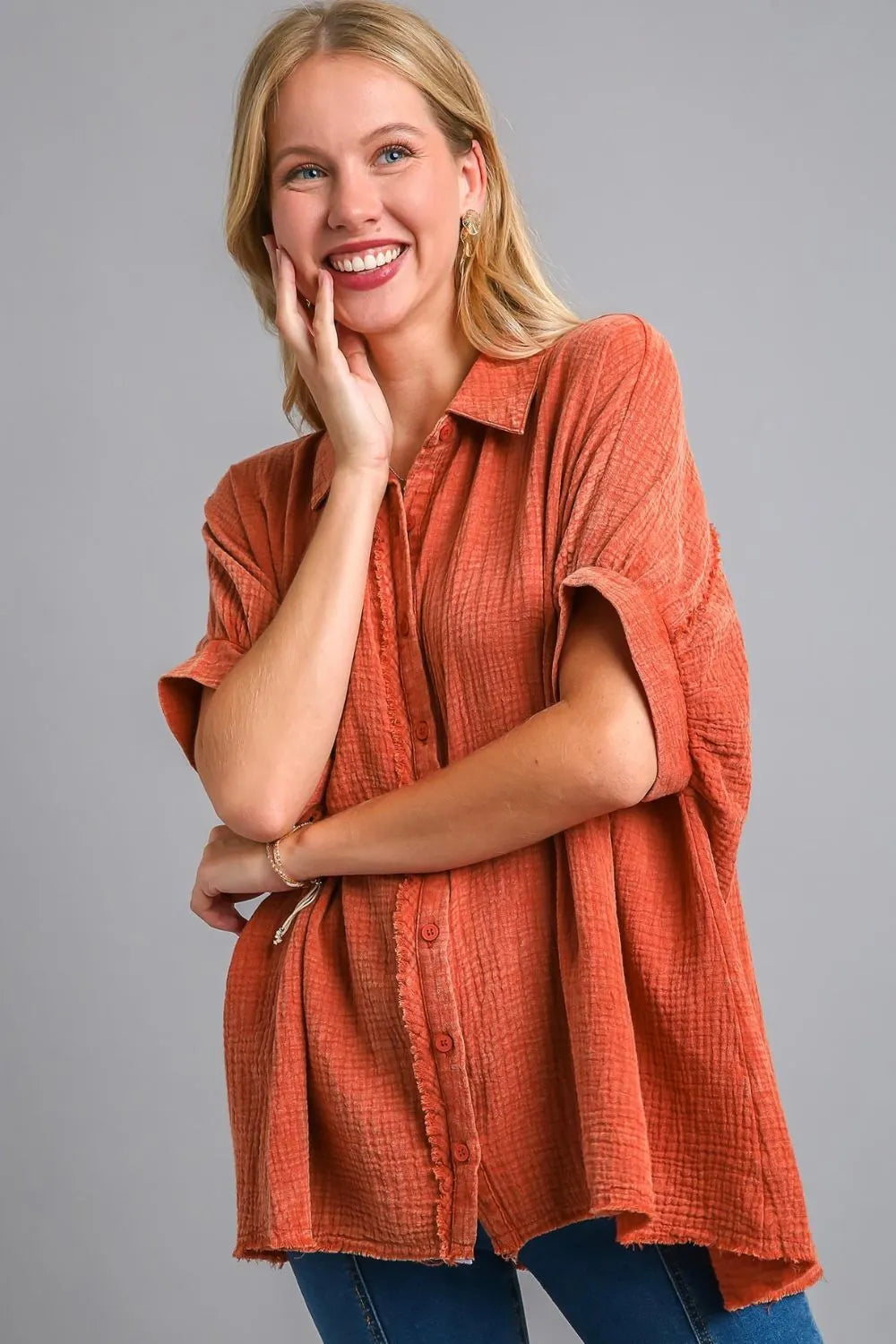 Orange-red Umgee plus size cotton gauze mineral wash button-down shirt with a relaxed fit and casual style.