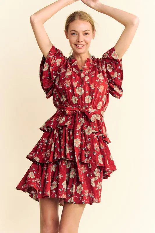 Orange rust Davi & Dani tiered mini dress with ruffle flutter sleeves and tie belt, perfect for casual or summer wear.