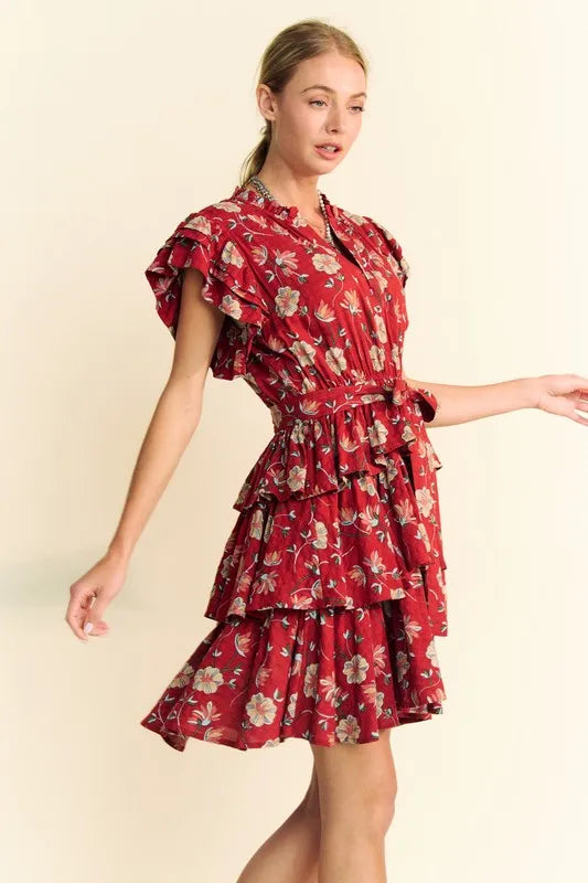 Orange rust Davi & Dani tiered mini dress with ruffle flutter sleeves and tie belt, perfect for casual or summer wear.