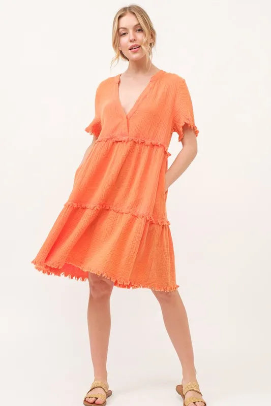 Orange washed frayed detail tiered dress by Trendsi, featuring layered fabric and casual boho style.
