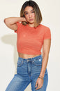 Orange Trendsi Basic Bae ribbed short sleeve T-shirt with round neckline, full size, casual fit, and soft fabric.