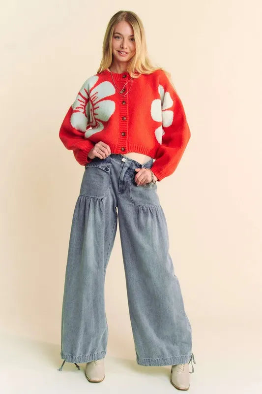 Orange Davi & Dani flower contrast round neck long sleeve cardigan with floral pattern and ribbed cuffs.