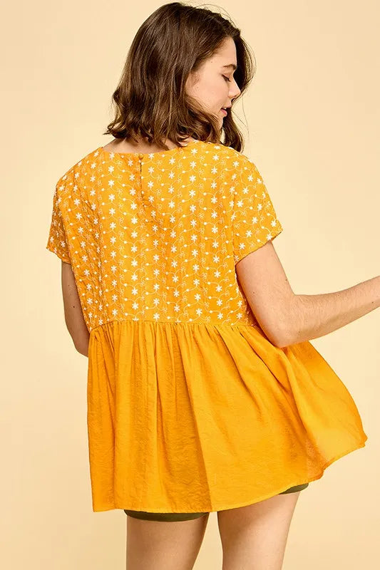 Orange lime 'N' Chili embroidered short sleeve pleated babydoll top by Trendsi, shown with detailed embroidery and pleated design.