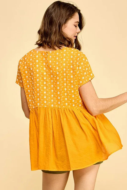 Orange lime 'N' Chili embroidered short sleeve pleated babydoll top by Trendsi, shown with detailed embroidery and pleated design.