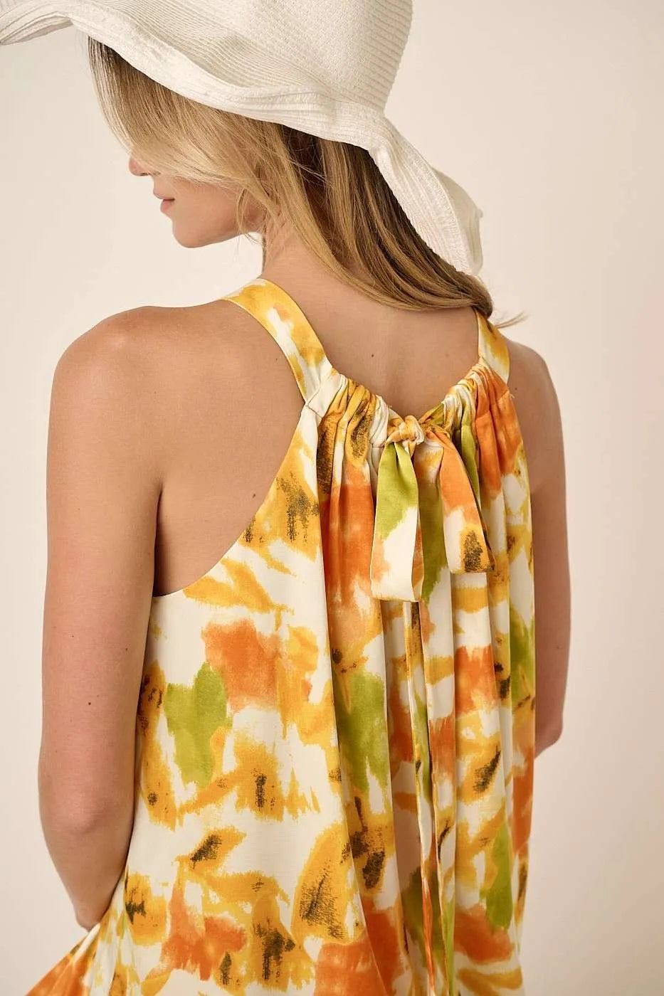 Orange watercolor print halter neck satin maxi dress by Mittoshop, elegant and flowing with a stylish halter design.