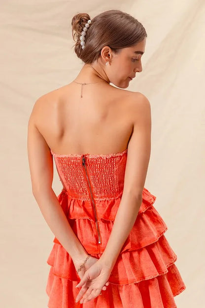 Orange strapless ruffle layered cheer-up dress by Trendsi, featuring a playful design perfect for game day or casual outings.