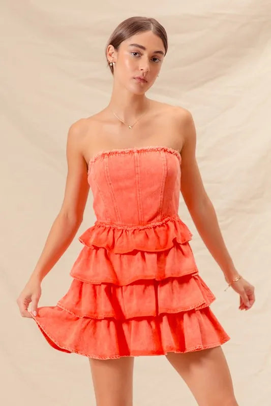 Orange strapless ruffle layered cheer-up dress by Trendsi, featuring a fun game day cheerleading style with ruffle details.