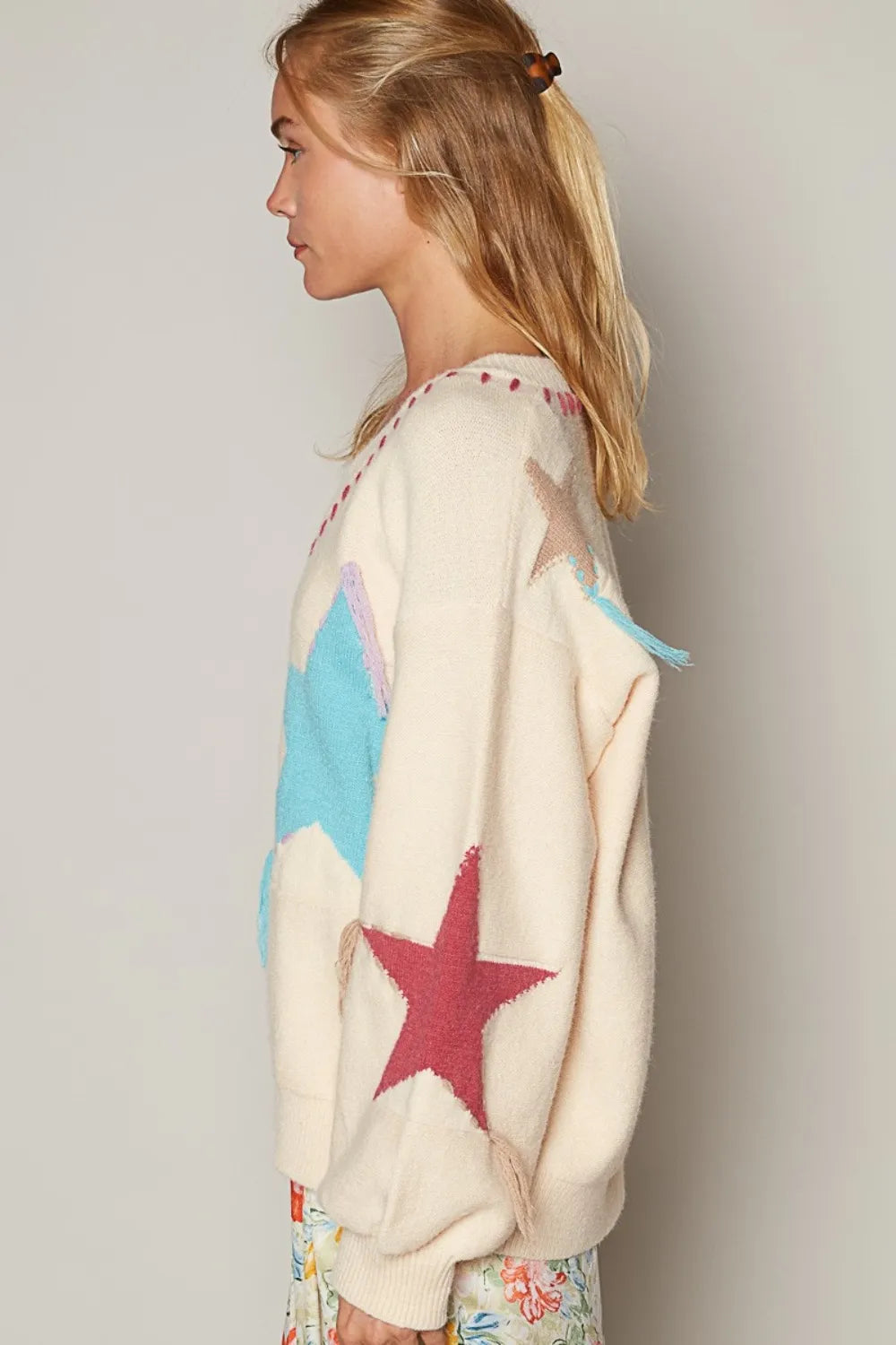 Pale beige POL V-neck long sleeve star fringe sweater by Trendsi, featuring a cozy knit with star details and fringe accents.