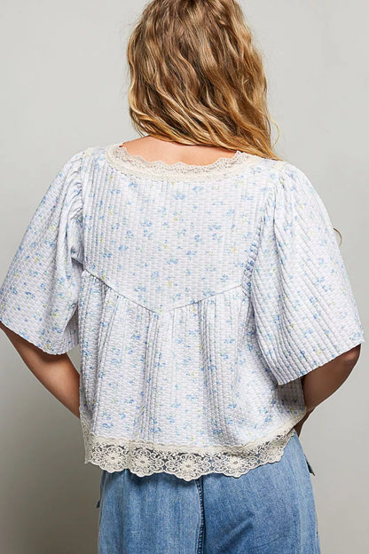Pale blue floral print lace trim blouse from Trendsi, featuring a feminine design and lightweight fabric.