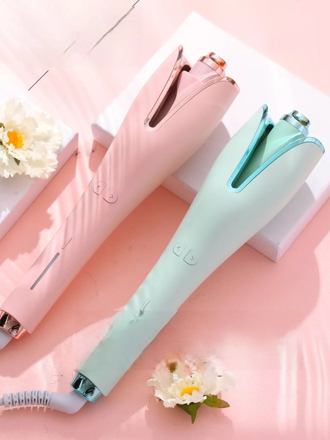 Trendsi automatic rotating hair curling iron in pale blush with European plug for effortless, even curls.