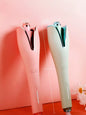 Automatic rotating hair curling iron by Trendsi, in pale blush with European plug, showcasing its sleek design and rotating barrel.