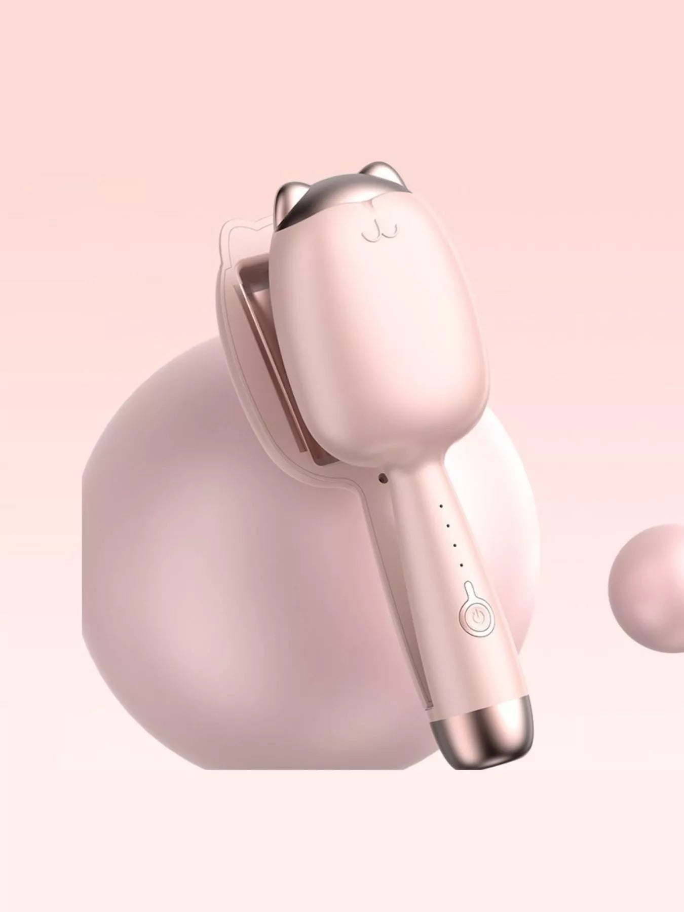 Cat-shaped heated curling iron in pale blush color with European plug, designed for creating stylish curls and waves.