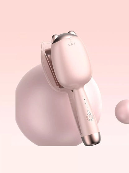 Cat-shaped heated curling iron in pale blush color with European plug, designed for creating stylish curls and waves.