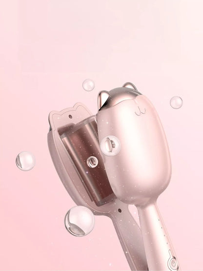 Cat-shaped heated curling iron by Trendsi with a pale blush finish and European plug, designed for curling and styling hair.