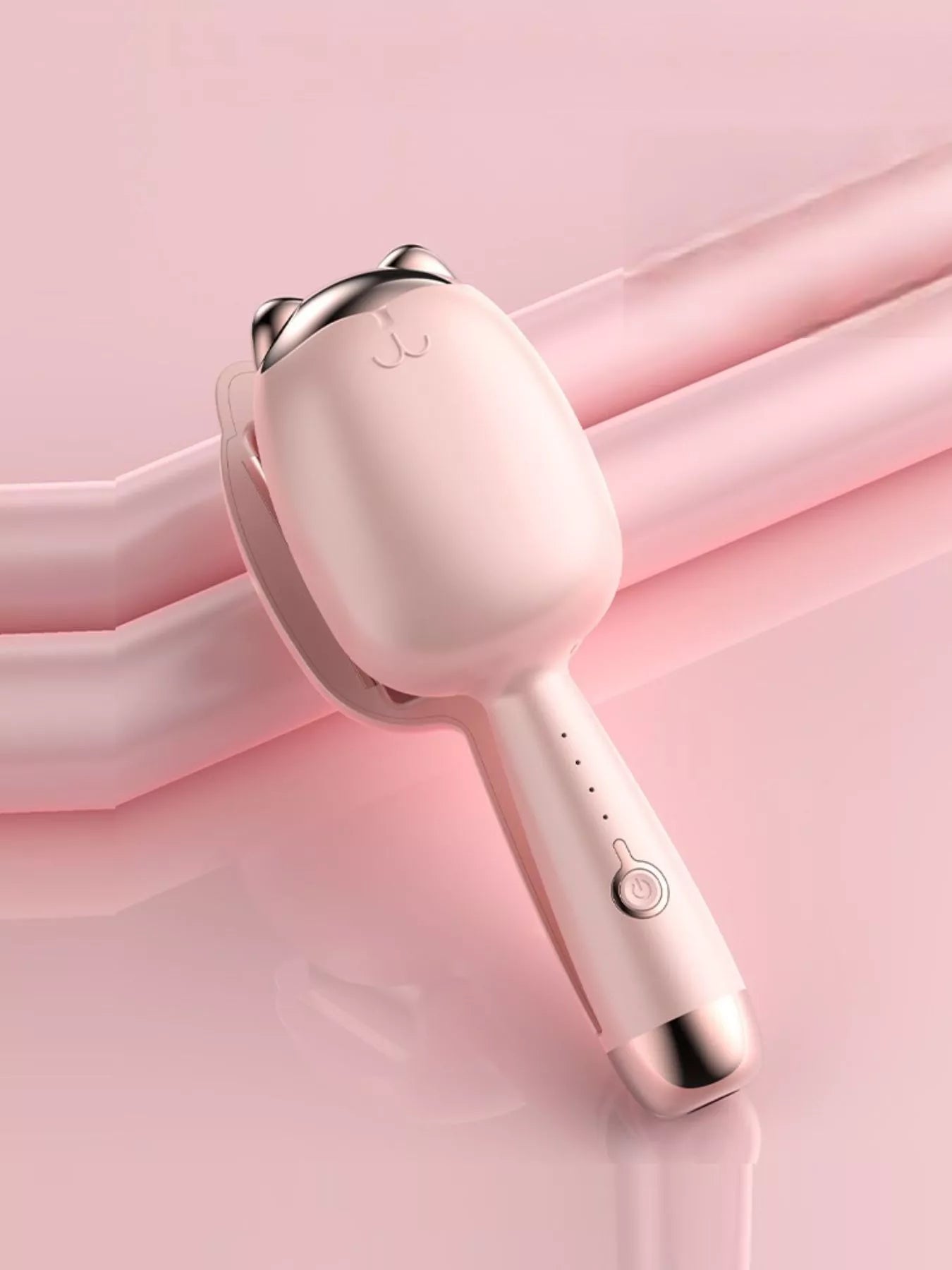 Cat-shaped heated curling iron in pale blush with European plug, designed for gentle, stylish curls from Trendsi.