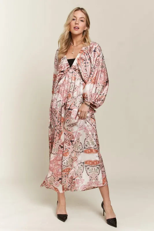 Pale blush ADORA printed V-neck dress with batwing sleeves, stylish and flowy, perfect for casual or dressy occasions.