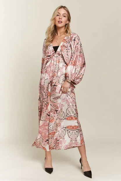 Pale blush ADORA printed V-neck dress with batwing sleeves, stylish and flowy, perfect for casual or dressy occasions.