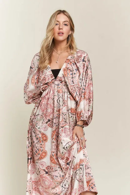 Pale blush ADORA printed V-neck dress with batwing sleeves, stylish and comfortable from Trendsi.