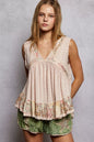 Pale pink Trendsi sleeveless ribbed top with lace and floral pattern trim, featuring ruffled details and elegant design.