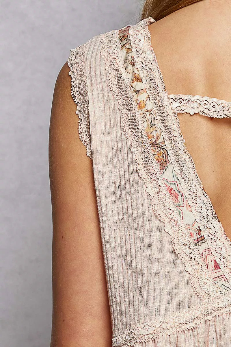Pale pink Trendsi sleeveless top with lace detail, ruffled ribbed fabric, and floral pattern trim.