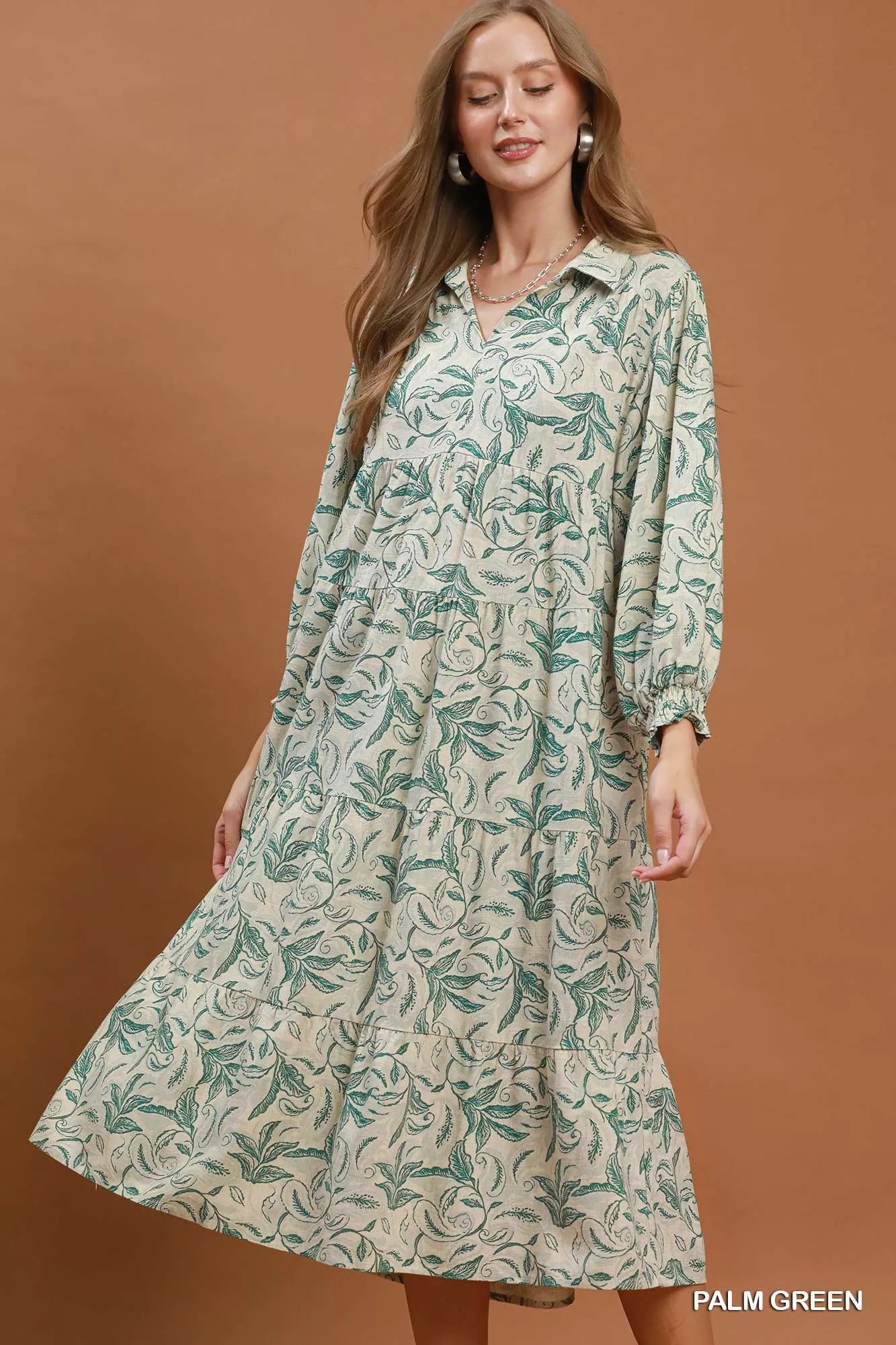 Palm green linen tiered midi dress by Umgee featuring botanical print and relaxed fit, perfect for casual summer wear.